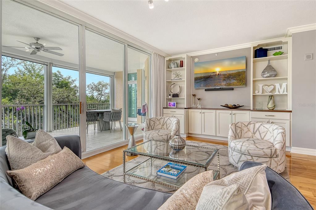 401 North Point Road, Unit 304 Osprey, FL 34229 - Photo 14 of 95 a living room with furniture and a large window
