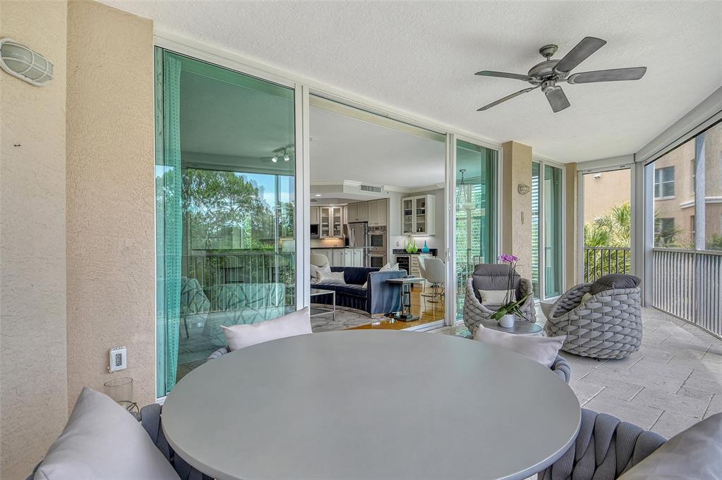 401 North Point Road, Unit 304 Osprey, FL 34229 - Photo 19 of 95 a view of living room with furniture and large window
