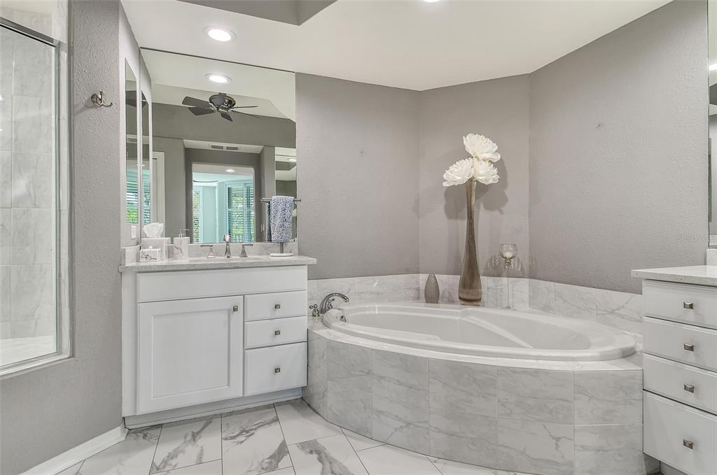 401 North Point Road, Unit 304 Osprey, FL 34229 - Photo 37 of 95 a bathroom with a double vanity sink mirror and