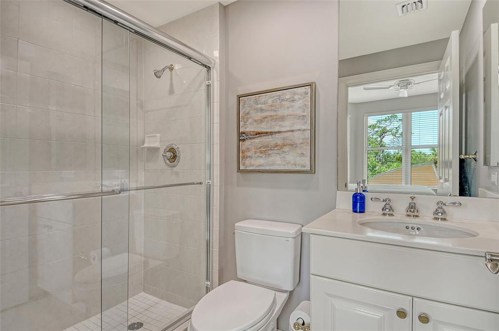 401 North Point Road, Unit 304 Osprey, FL 34229 - Photo 47 of 95 a bathroom with a sink toilet and shower