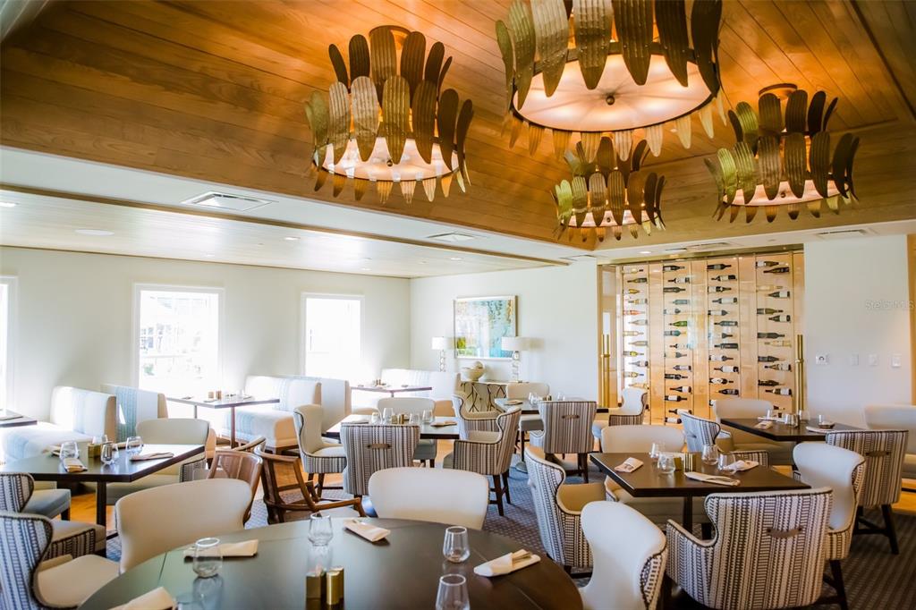 401 North Point Road, Unit 304 Osprey, FL 34229 - Photo 70 of 95 a living room with lots of furniture and chandelier