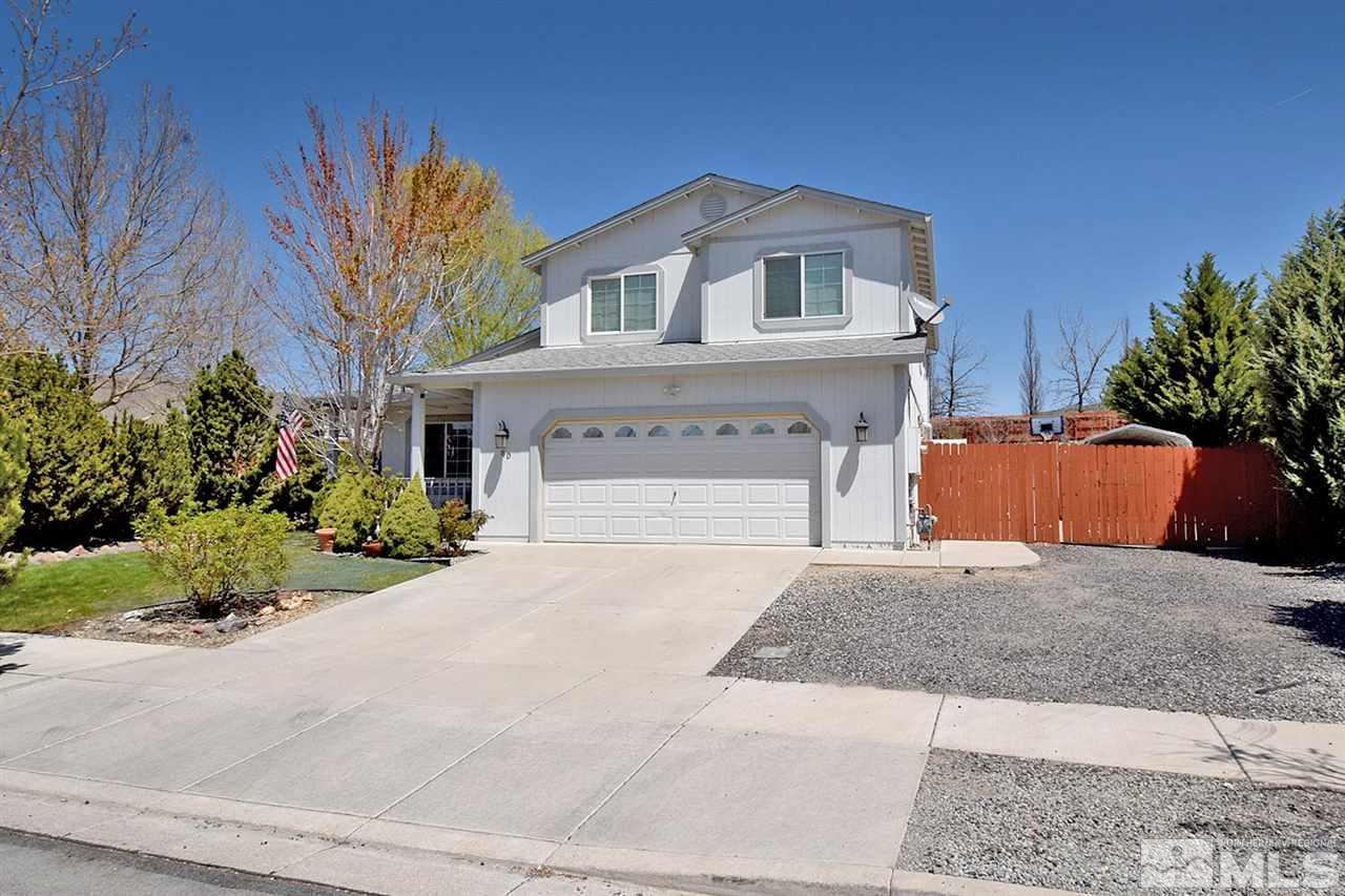 80 Calistoga Court Reno, NV 89508 - Photo 2 of 39 a front view of a house with a yard and garage