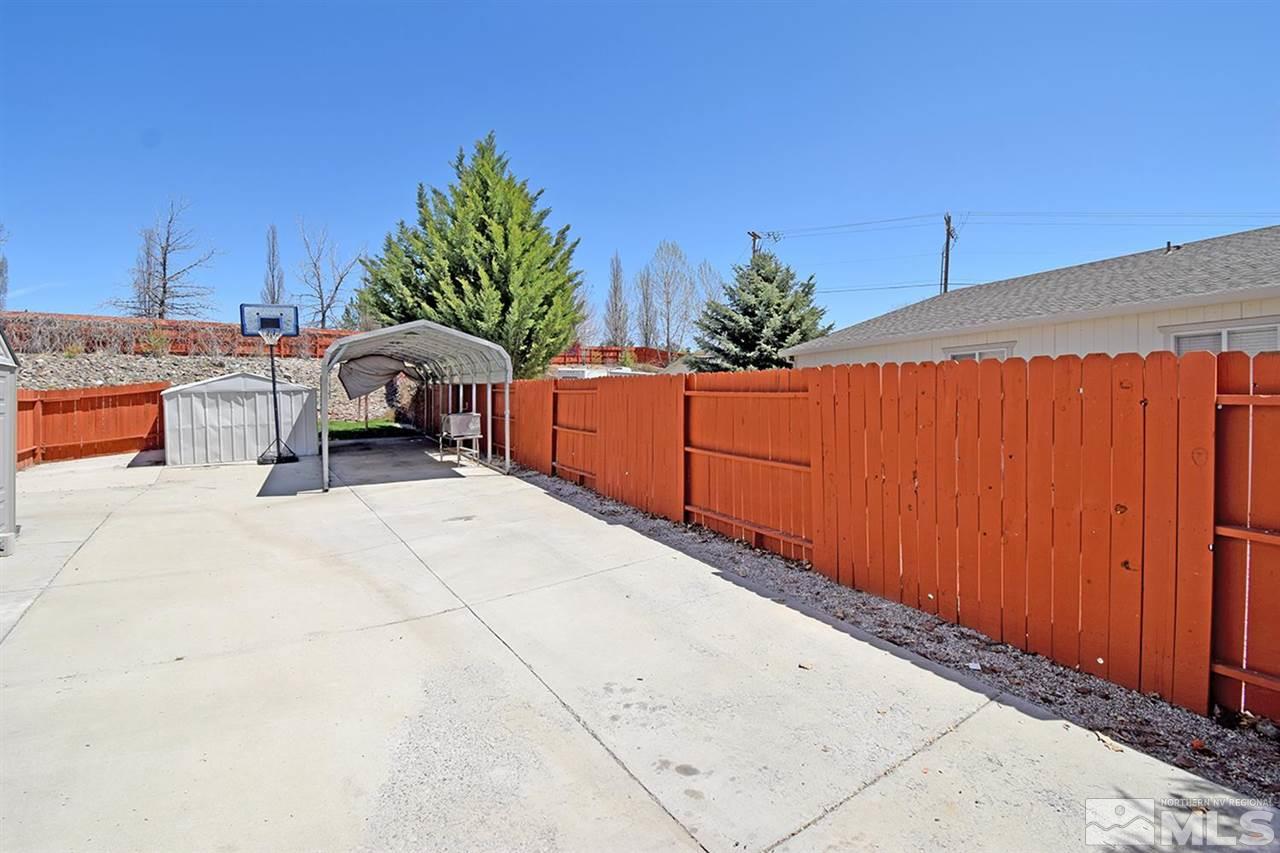 80 Calistoga Court Reno, NV 89508 - Photo 32 of 39 a backyard of a house with table and chairs