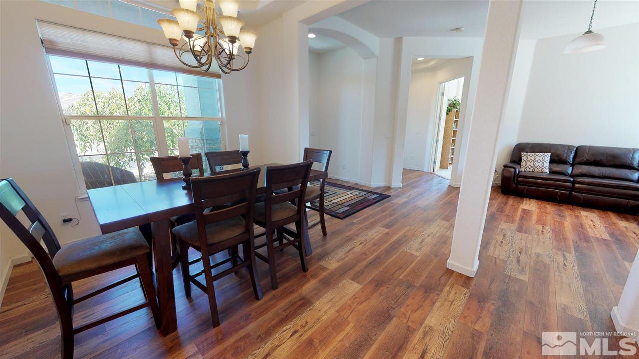 1790 Gold Belt Drive Reno, NV 89521 - Photo 7 of 25 a view of a dining room with furniture window and wooden floor