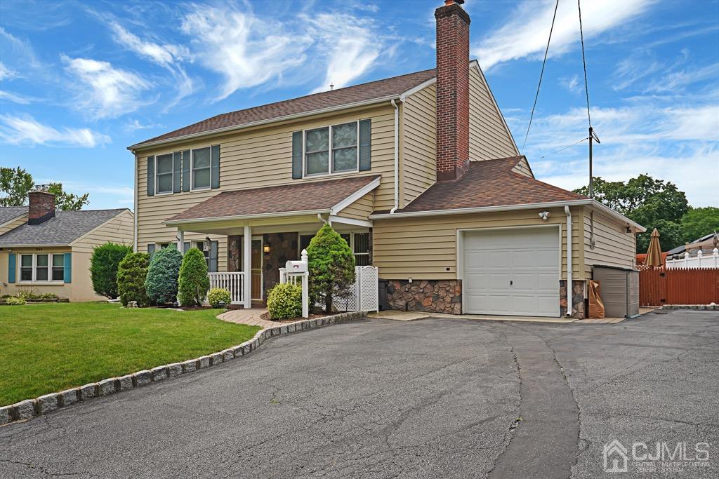 210 Oak Drive Middlesex, NJ 08846 - Photo 2 of 27 a front view of a house with a yard