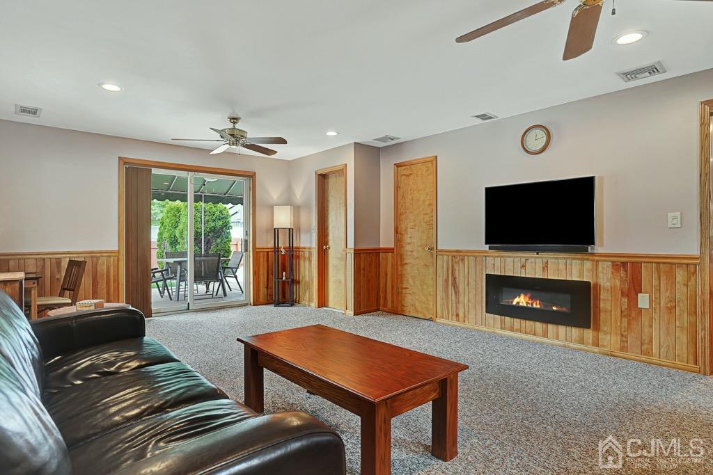 210 Oak Drive Middlesex, NJ 08846 - Photo 11 of 27 a living room with furniture fireplace and flat screen tv
