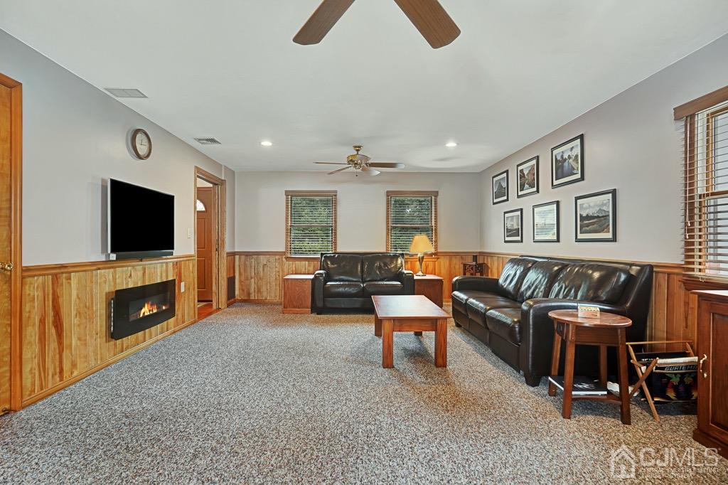 210 Oak Drive Middlesex, NJ 08846 - Photo 13 of 27 a living room with furniture and a flat screen tv