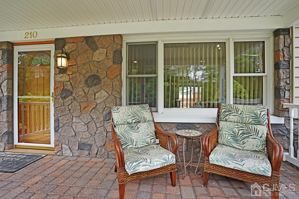 210 Oak Drive Middlesex, NJ 08846 - Photo 3 of 27 a outdoor living area with furniture and a window