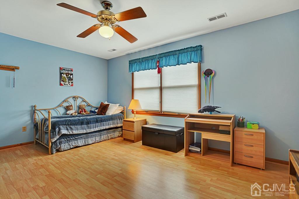 210 Oak Drive Middlesex, NJ 08846 - Photo 21 of 27 a bedroom with furniture and a window