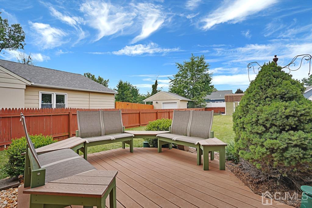 210 Oak Drive Middlesex, NJ 08846 - Photo 26 of 27 a view of backyard with seating space and trees