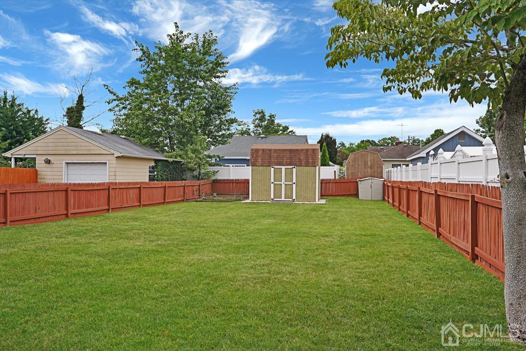 210 Oak Drive Middlesex, NJ 08846 - Photo 27 of 27 a view of a backyard with a garden and deck