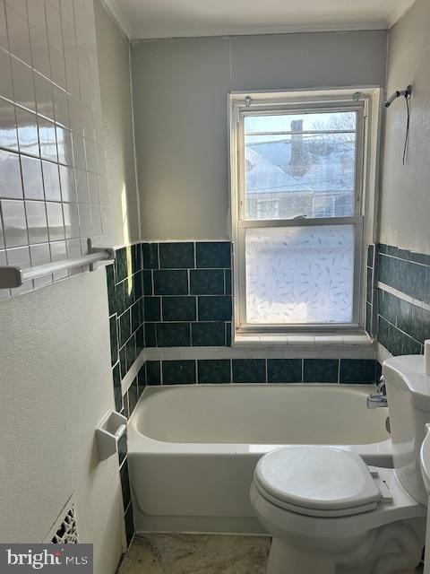 1082 Trent Road Camden, NJ 08104 - Photo 6 of 9 a bathroom with a toilet bathtub and window