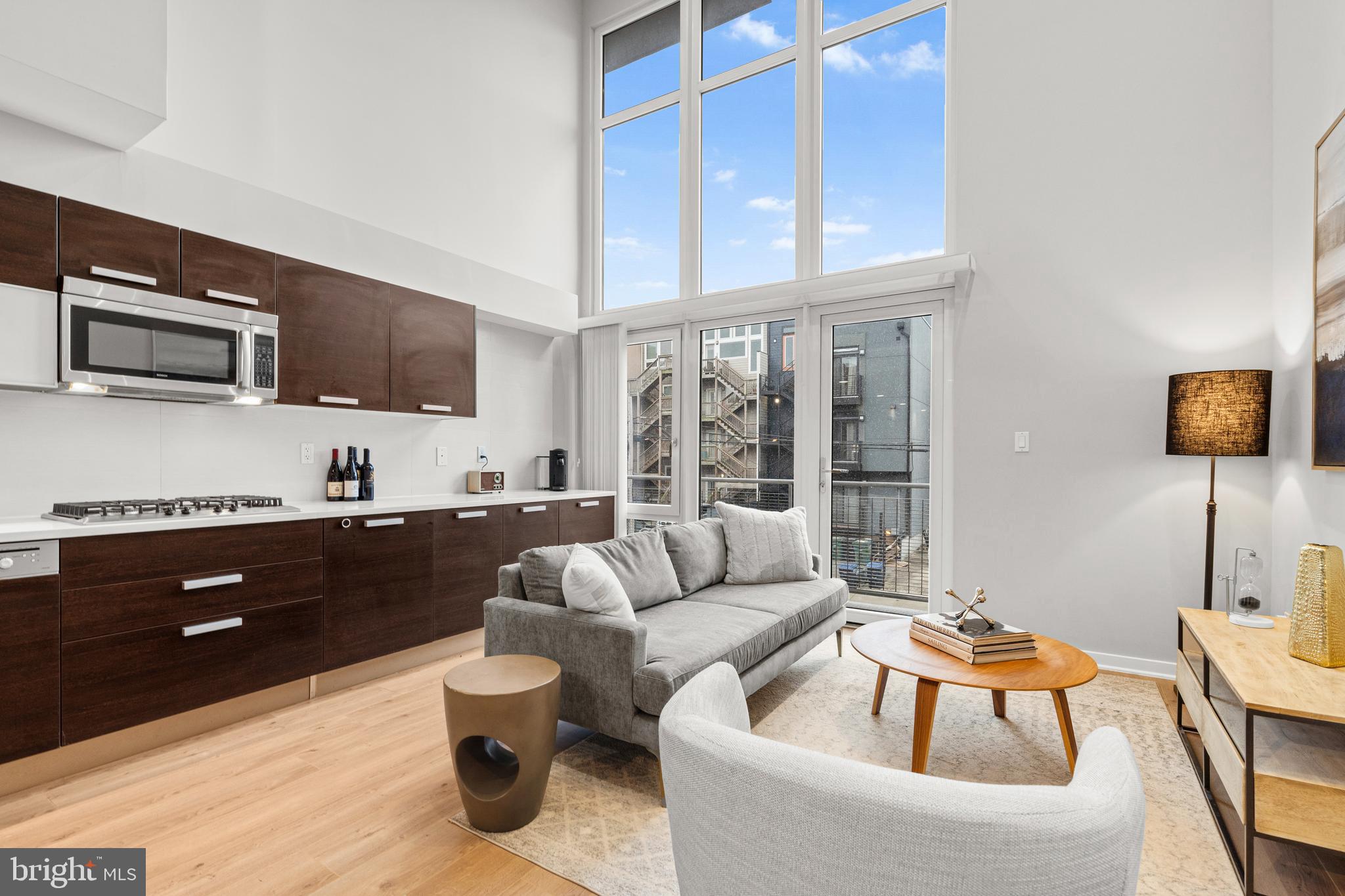 1466 Harvard Street Northwest, Unit A2 Washington, DC 20009 - Photo 1 of 31 a living room with furniture and a flat screen tv