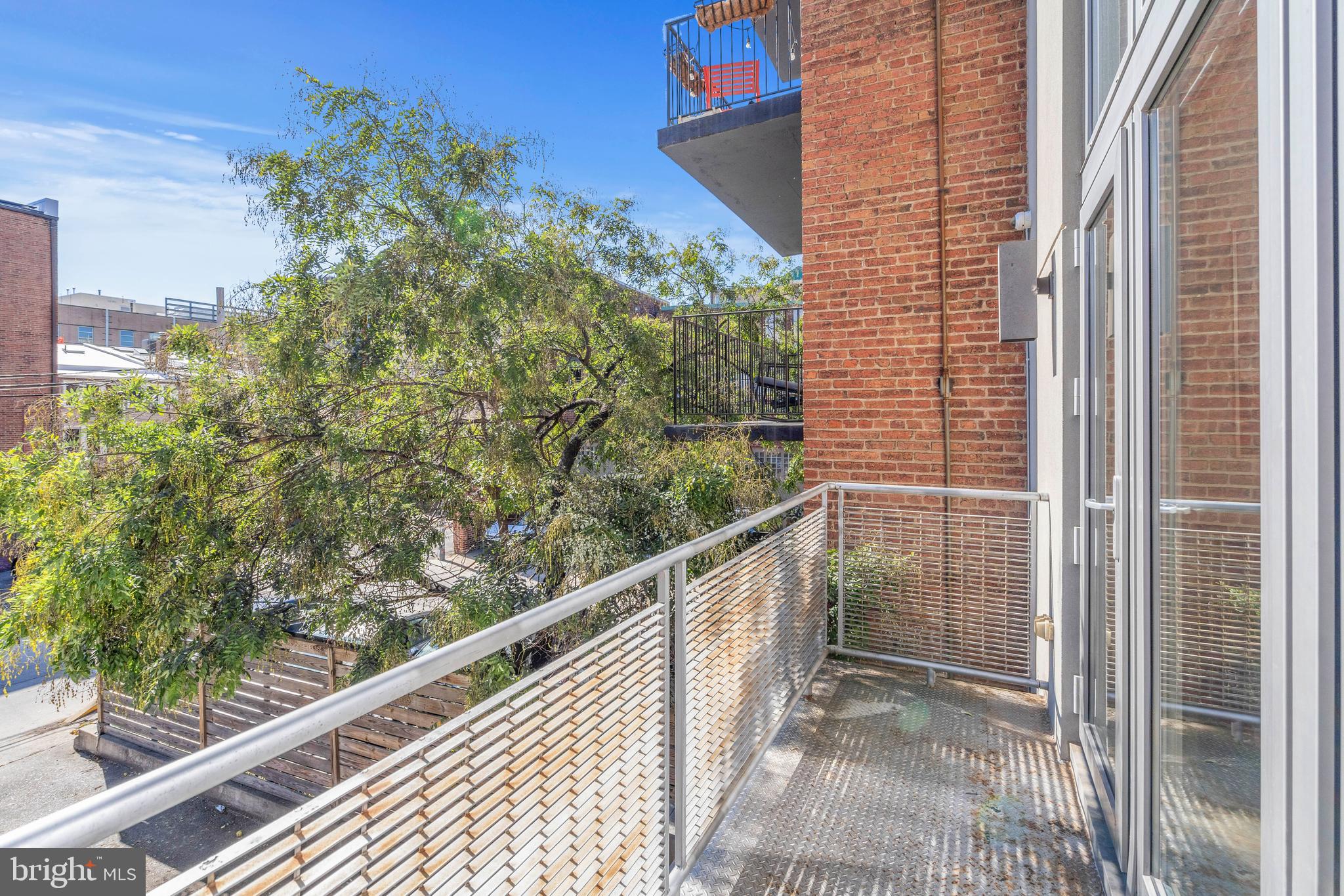 1466 Harvard Street Northwest, Unit A2 Washington, DC 20009 - Photo 12 of 31 a view of a balcony with a tree