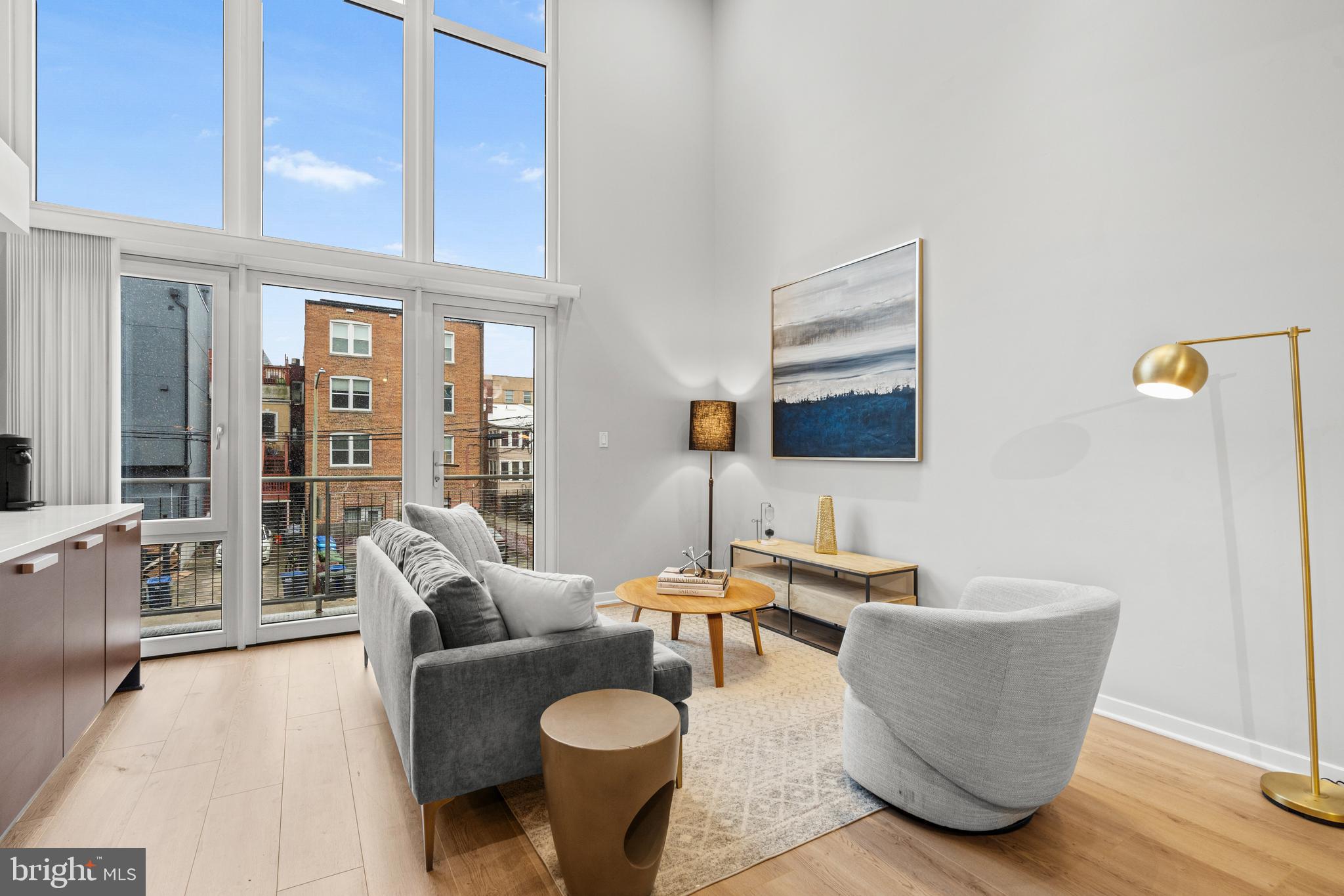 1466 Harvard Street Northwest, Unit A2 Washington, DC 20009 - Photo 2 of 31 a living room with furniture and a flat screen tv