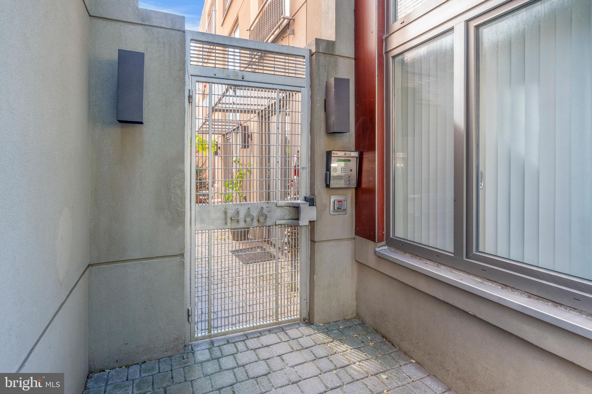1466 Harvard Street Northwest, Unit A2 Washington, DC 20009 - Photo 28 of 31 a view of a bathroom with a glass door and a window