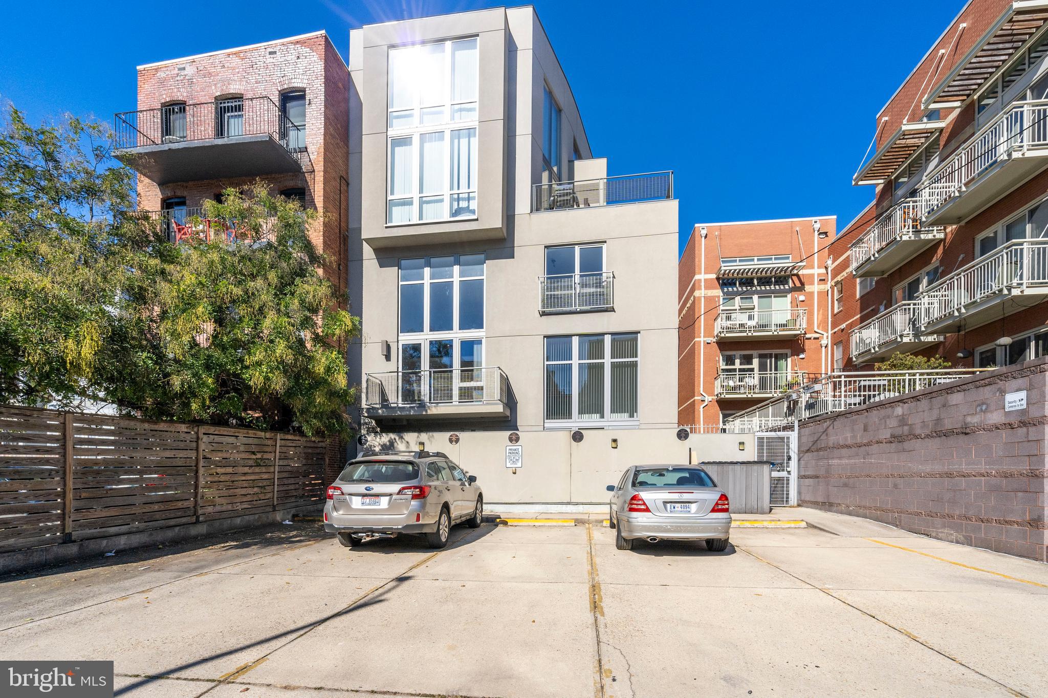 1466 Harvard Street Northwest, Unit A2 Washington, DC 20009 - Photo 29 of 31 a car parked in front of a building