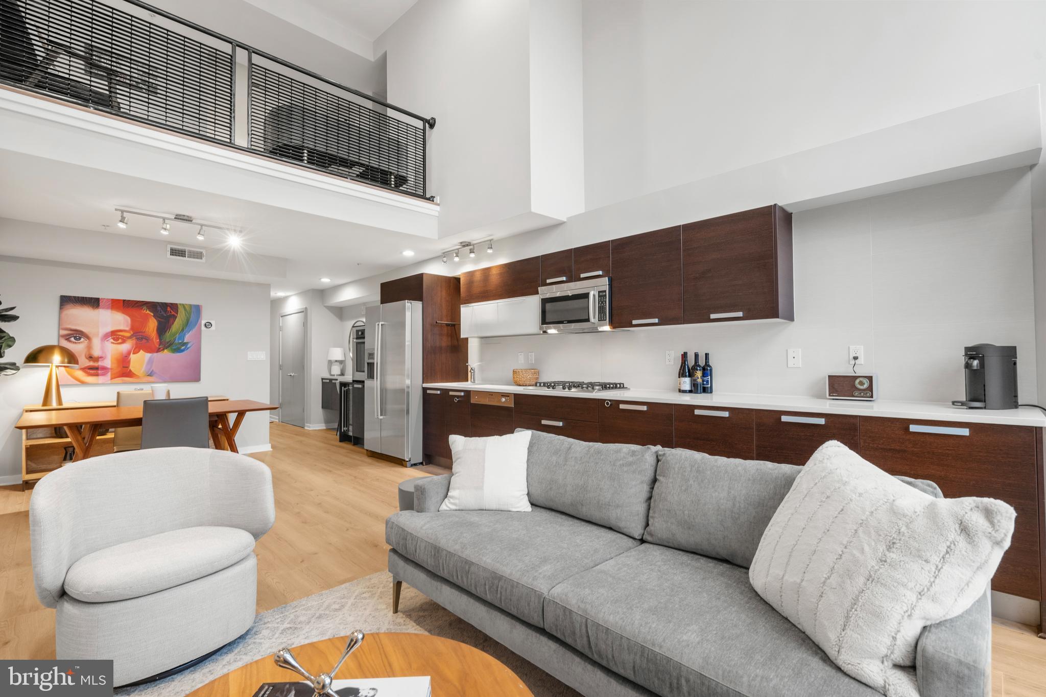 1466 Harvard Street Northwest, Unit A2 Washington, DC 20009 - Photo 3 of 31 a living room with furniture and a flat screen tv