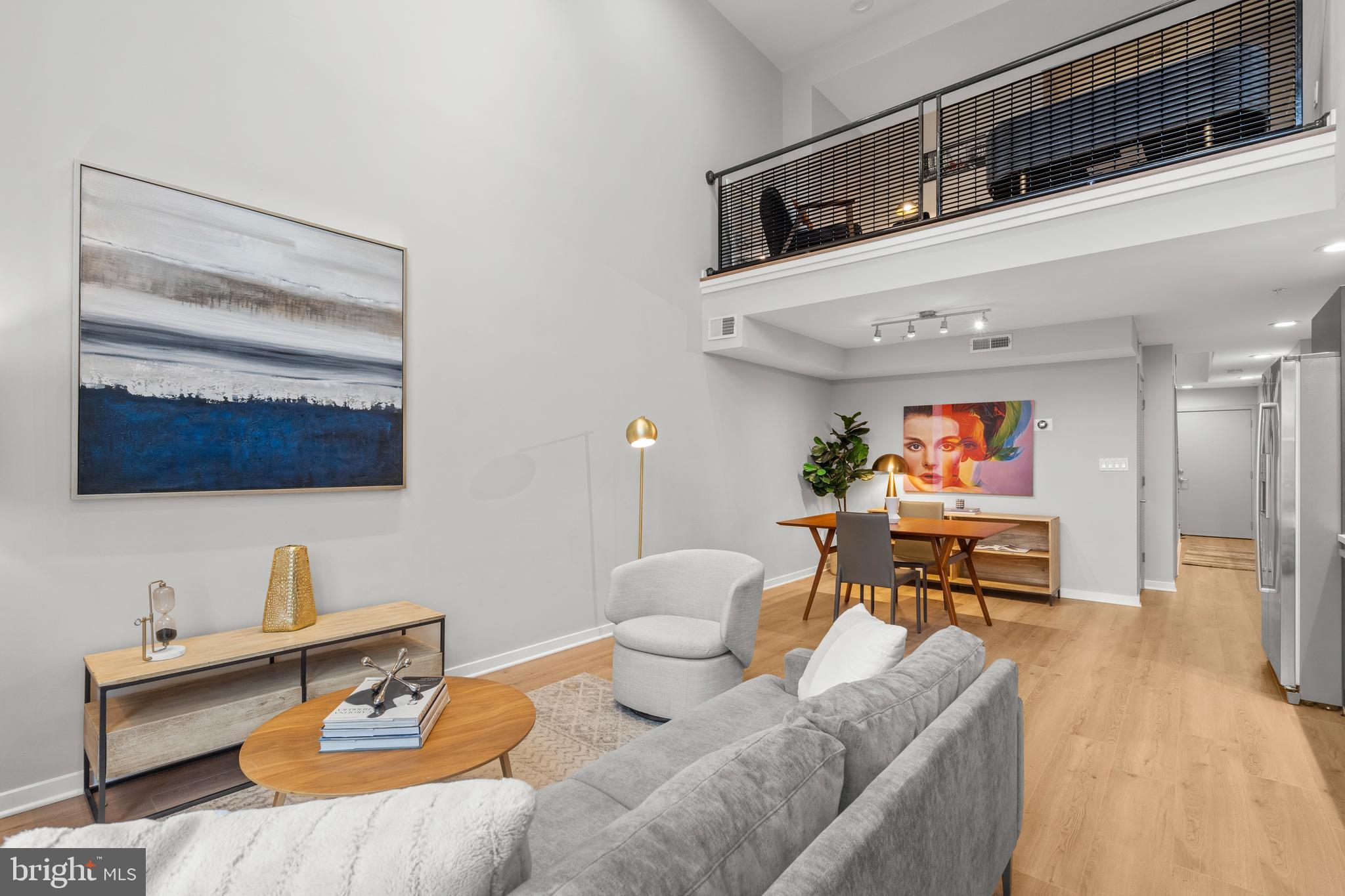 1466 Harvard Street Northwest, Unit A2 Washington, DC 20009 - Photo 4 of 31 a living room with furniture and a flat screen tv