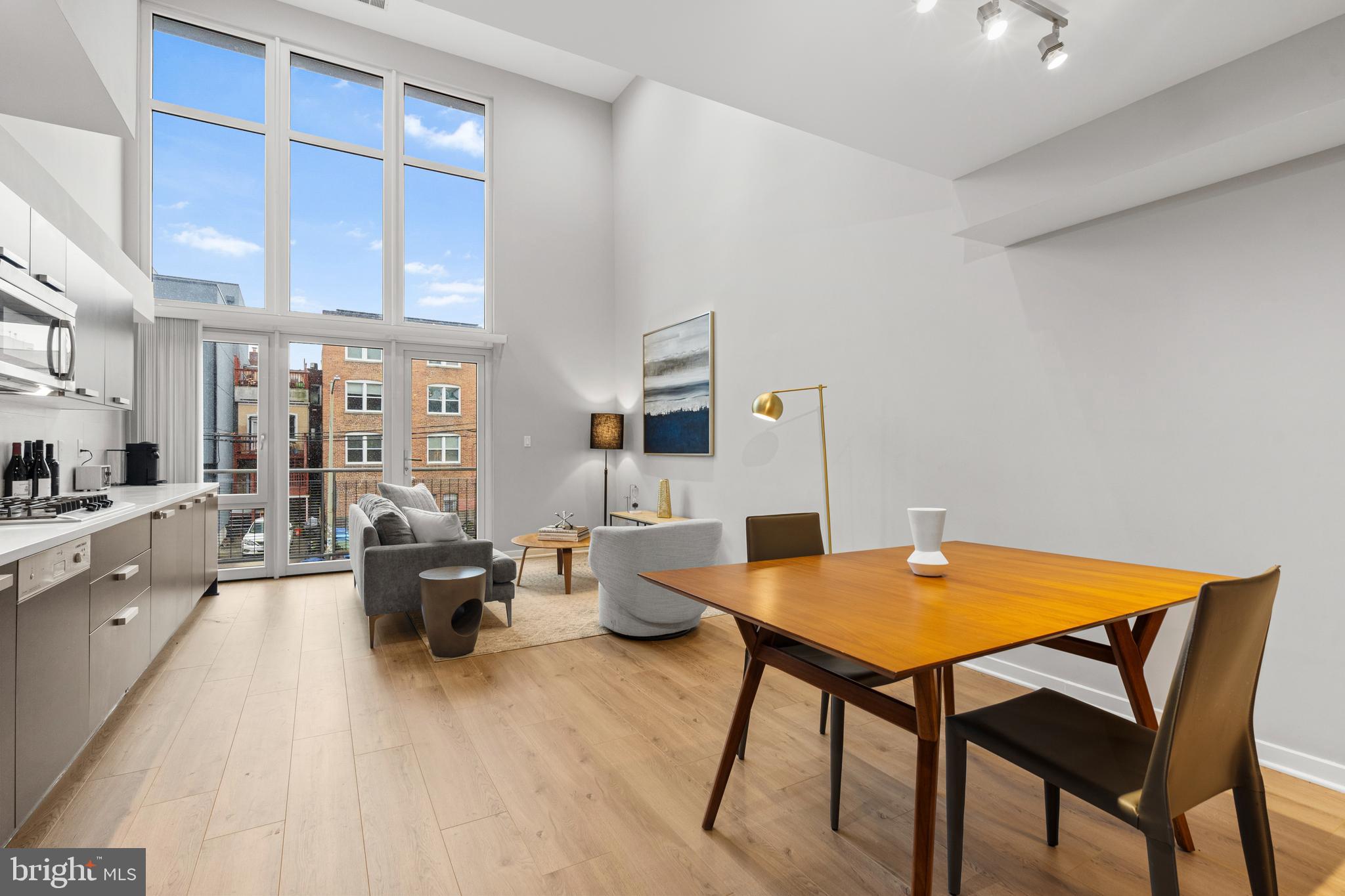 1466 Harvard Street Northwest, Unit A2 Washington, DC 20009 - Photo 6 of 31 a living room with fireplace furniture and a rug