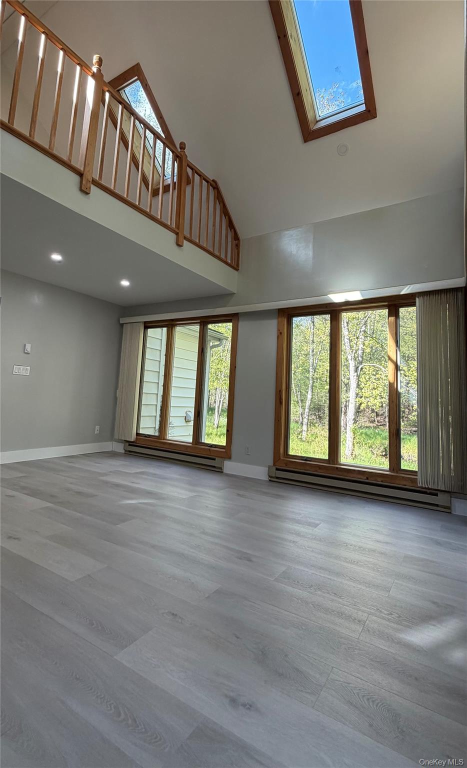 60 Medallion Road Kiamesha Lake, NY 12751 - Photo 7 of 44 a view of an empty room with wooden floor and a window