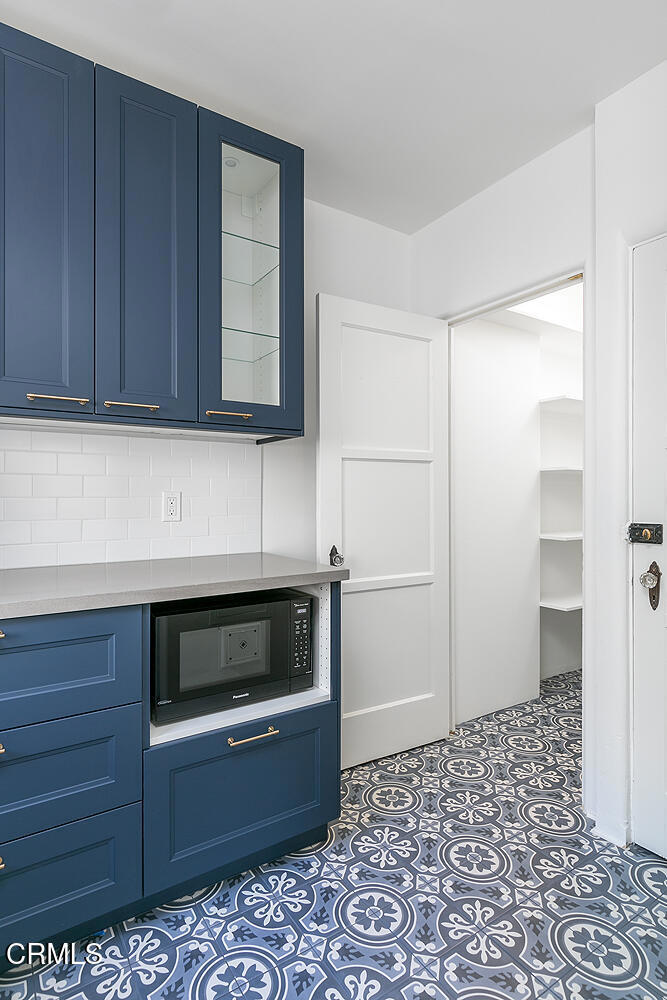 5240 Ellenwood Place Los Angeles, CA 90041 - Photo 11 of 25 a kitchen with granite countertop white cabinets and stainless steel appliances