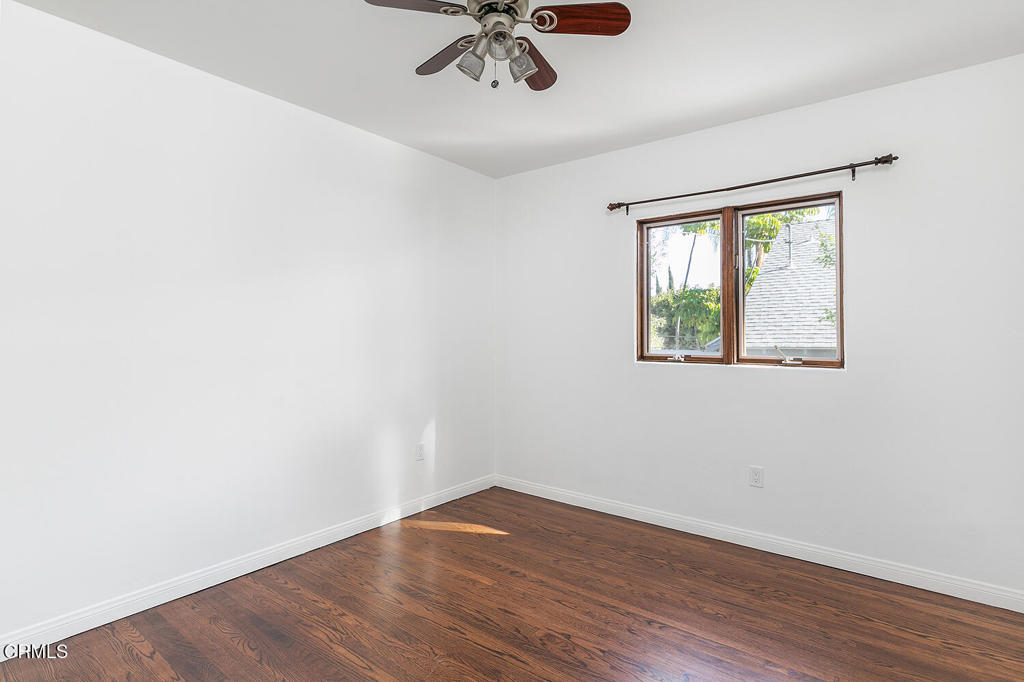 5240 Ellenwood Place Los Angeles, CA 90041 - Photo 18 of 25 an empty room with a window and a ceiling fan