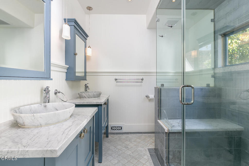 5240 Ellenwood Place Los Angeles, CA 90041 - Photo 21 of 25 a bathroom with a granite countertop sink and mirror