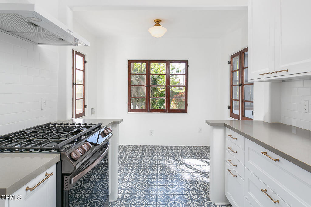 5240 Ellenwood Place Los Angeles, CA 90041 - Photo 9 of 25 a kitchen with granite countertop a stove and a sink