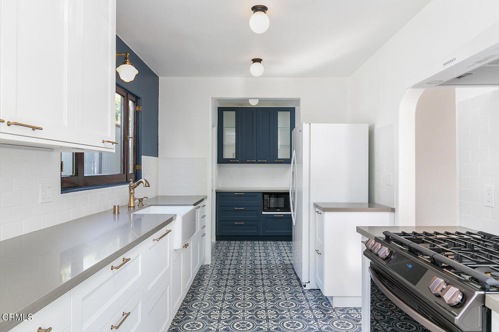 5240 Ellenwood Place Los Angeles, CA 90041 - Photo 10 of 25 a kitchen with granite countertop a stove and a sink
