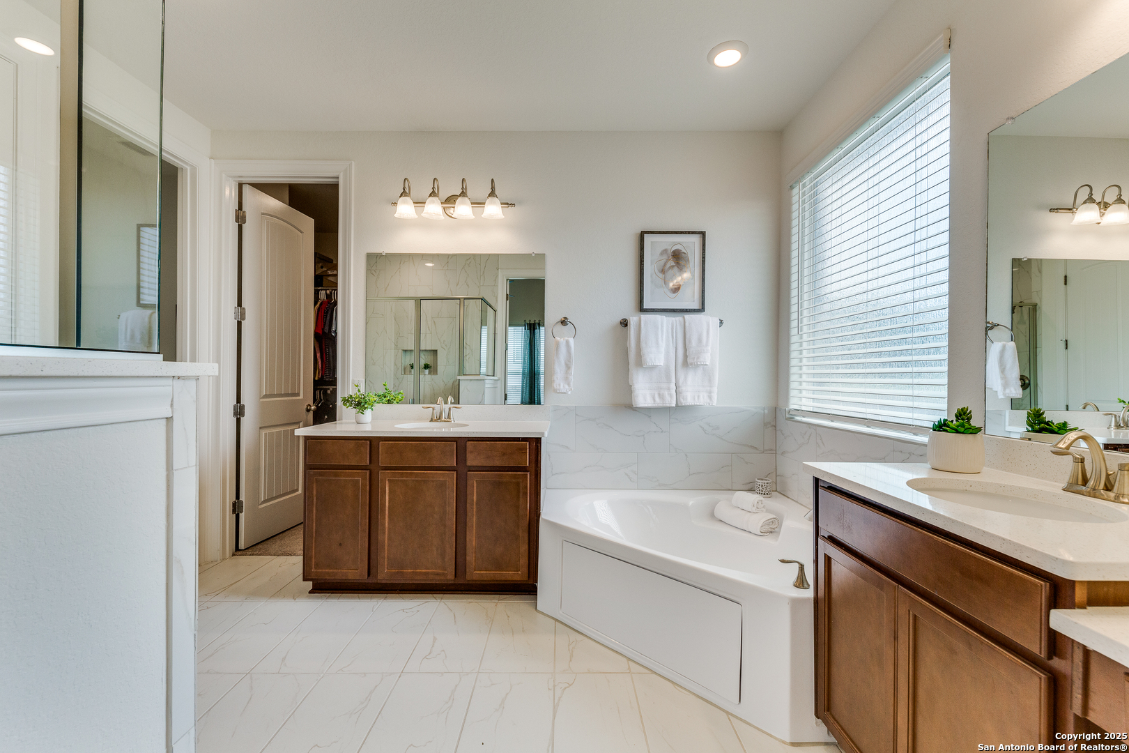 390 Rhapsody View Spring Branch, TX 78070 - Photo 19 of 39 a bathroom with a tub sink and mirror