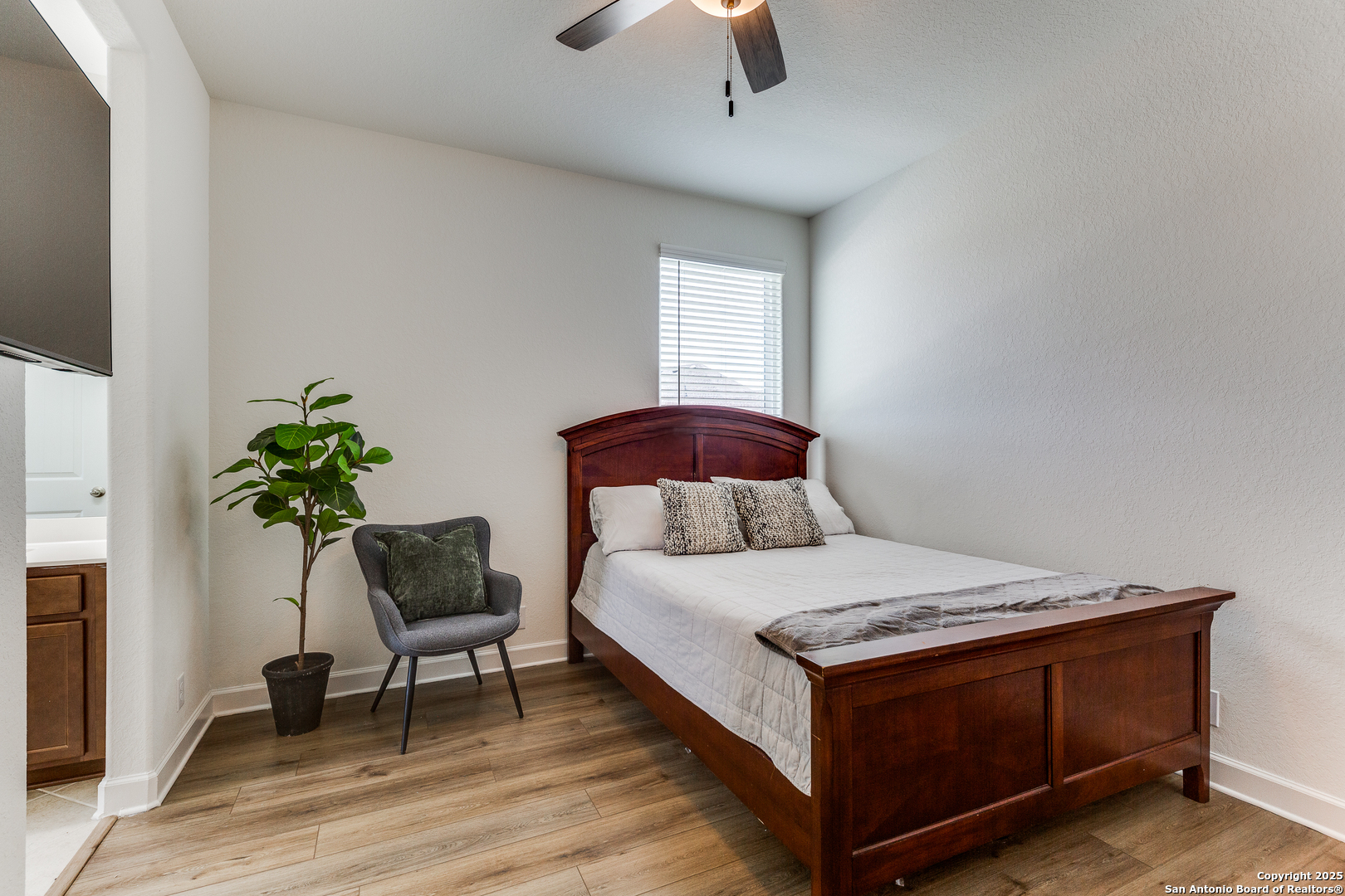 390 Rhapsody View Spring Branch, TX 78070 - Photo 25 of 39 a bedroom with a bed and a chair