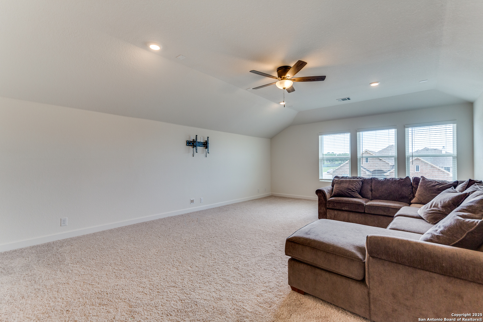 390 Rhapsody View Spring Branch, TX 78070 - Photo 28 of 39 a living room with furniture and a ceiling fan