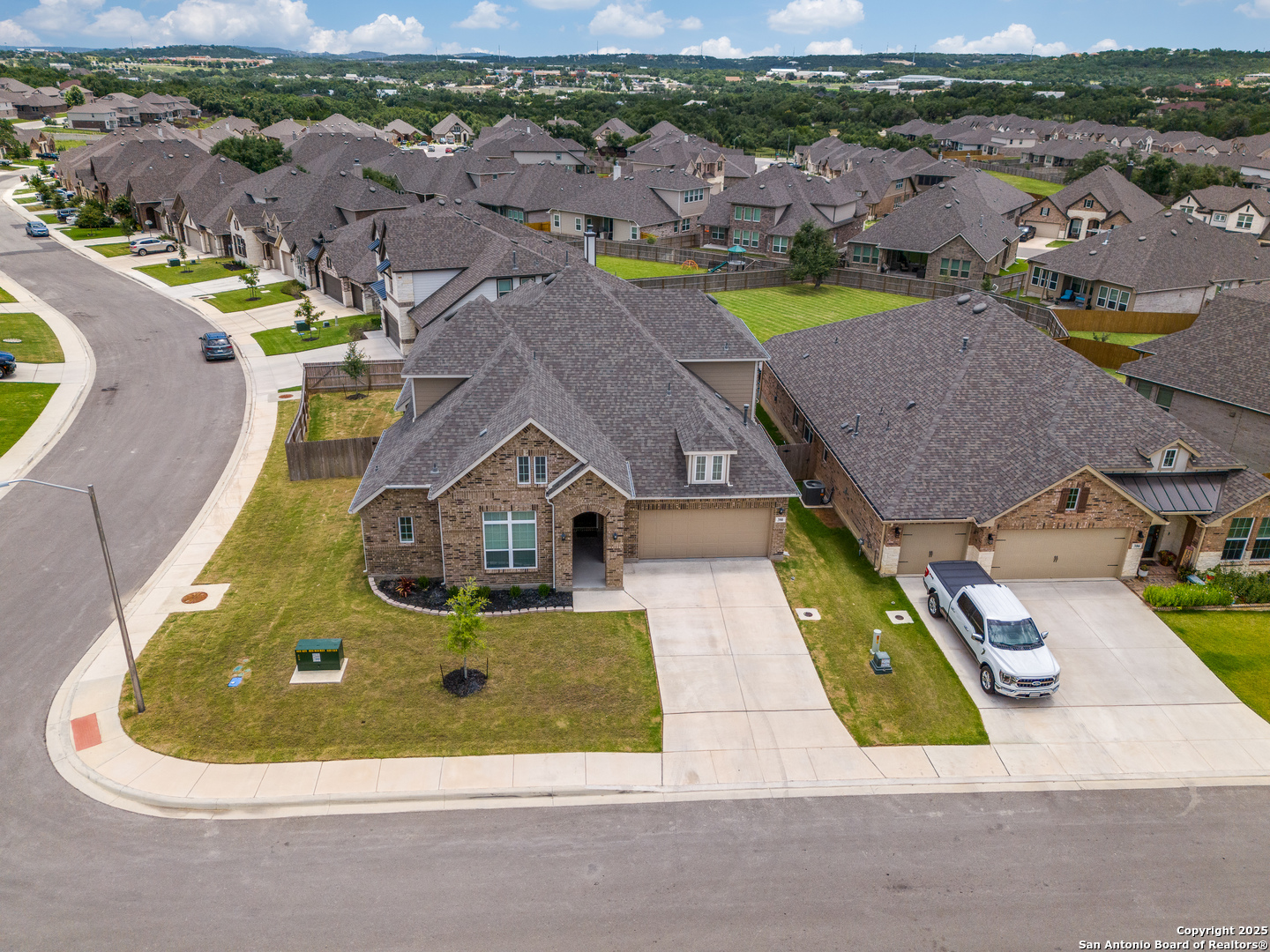 390 Rhapsody View Spring Branch, TX 78070 - Photo 3 of 39 an aerial view of a house with a swimming pool