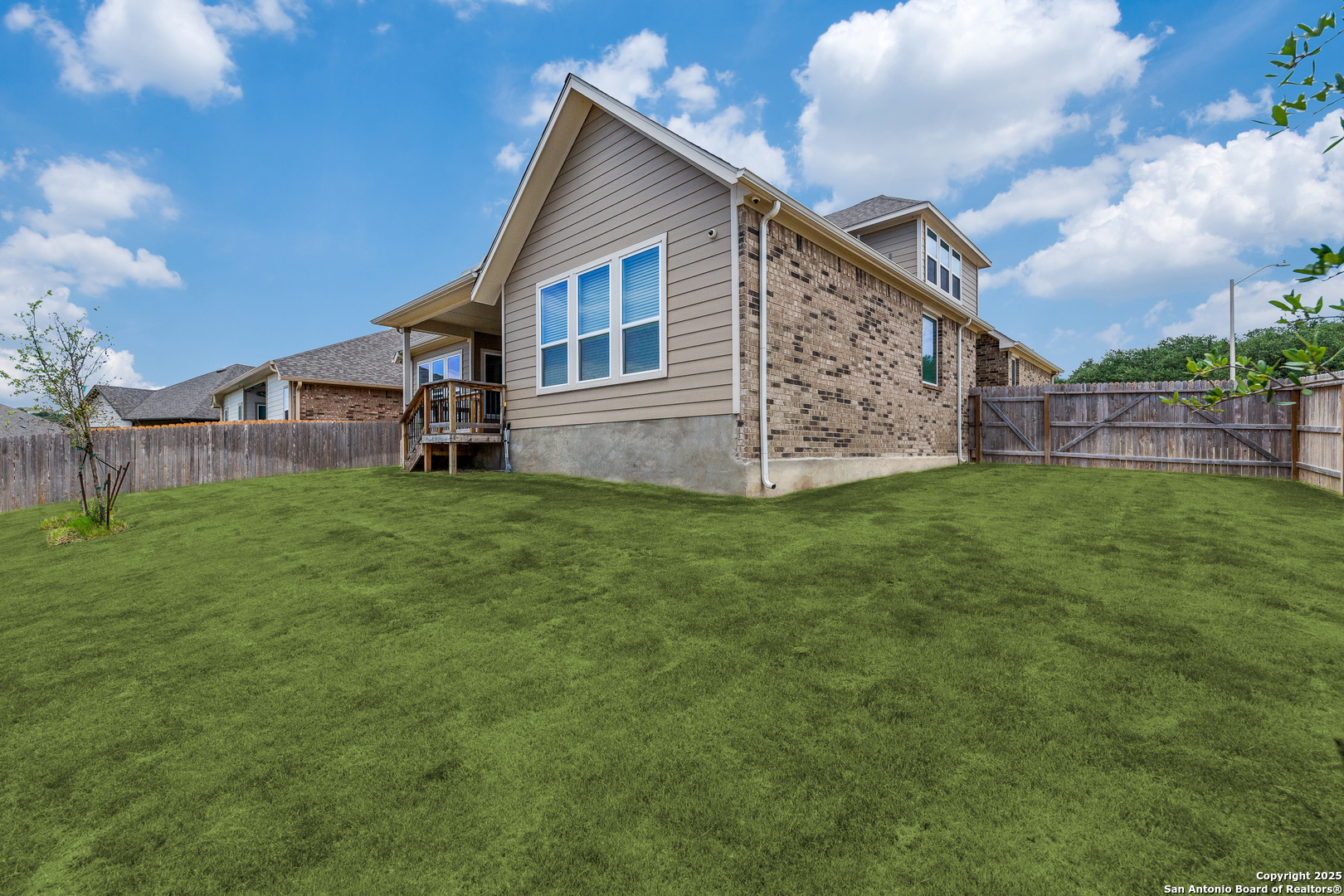 390 Rhapsody View Spring Branch, TX 78070 - Photo 34 of 39 a view of a house with a yard and sitting area