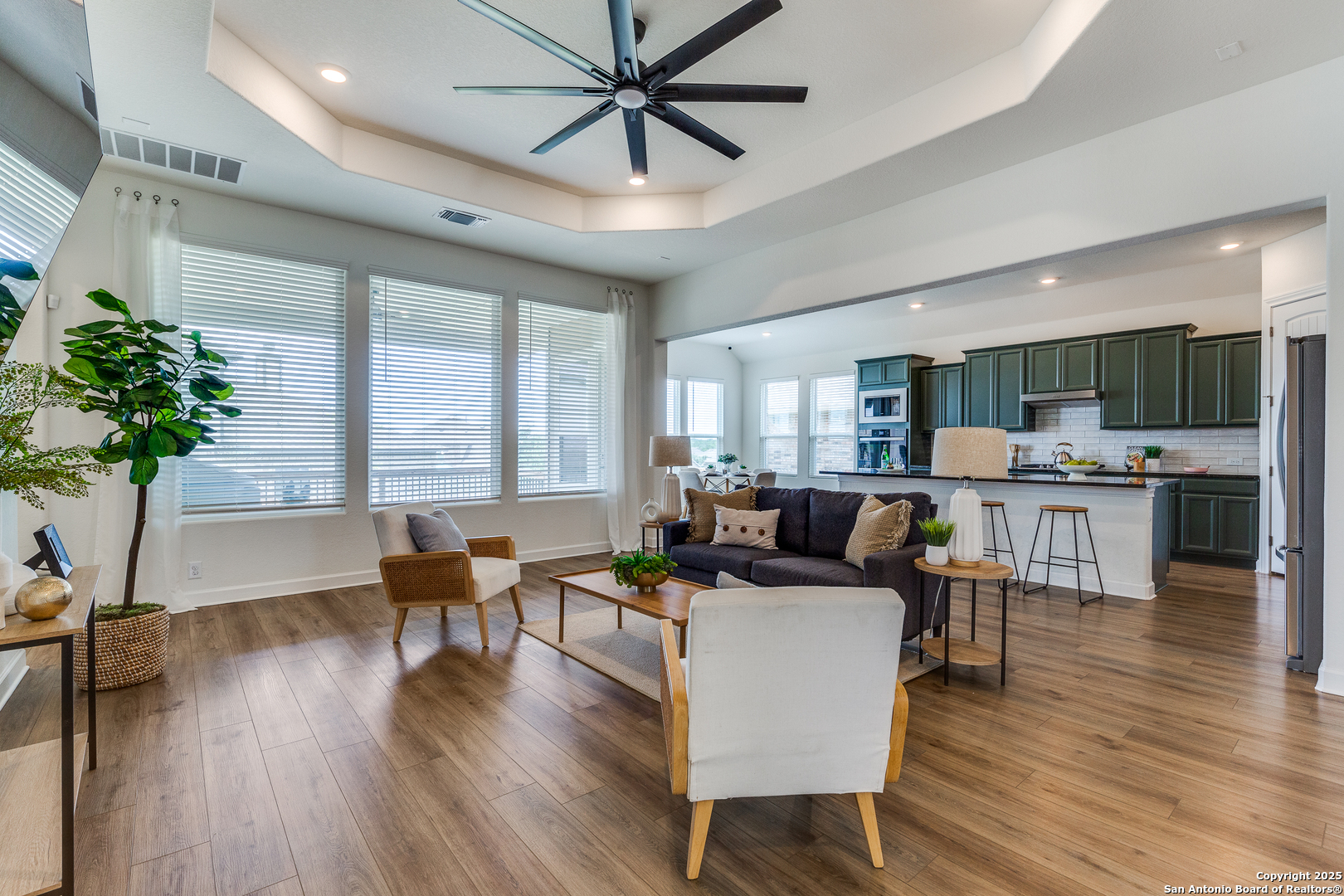 390 Rhapsody View Spring Branch, TX 78070 - Photo 5 of 39 a living room with furniture or kitchen view and a wooden floor
