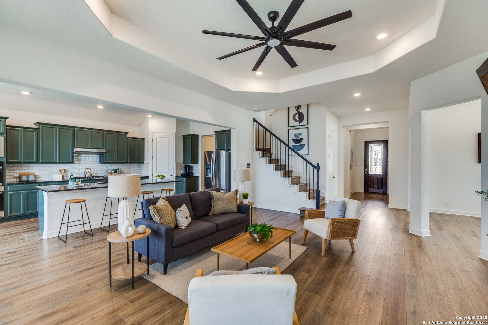 390 Rhapsody View Spring Branch, TX 78070 - Photo 6 of 39 a living room with furniture and kitchen view with wooden floor