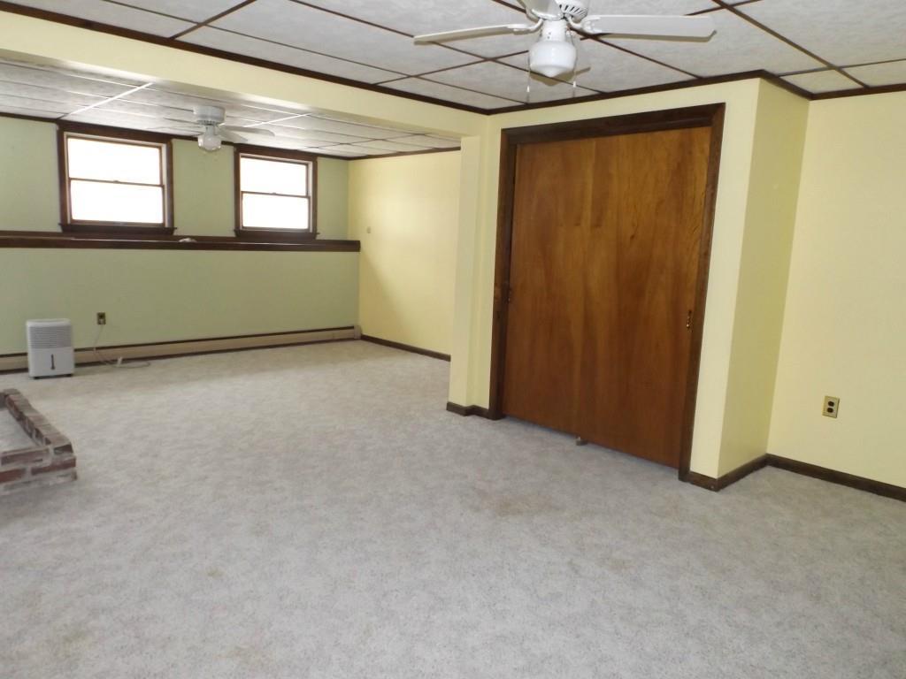 234 Kidder Hill Road Holden, ME 04429 - Photo 30 of 35 Basement family room with closet and...