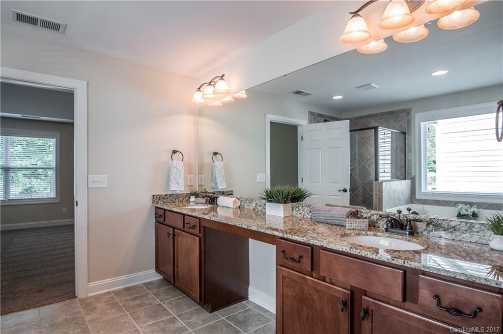 1108 Ridgehaven Road Waxhaw, NC 28173 - Photo 14 of 24 a bathroom with a sink double vanity and a mirror