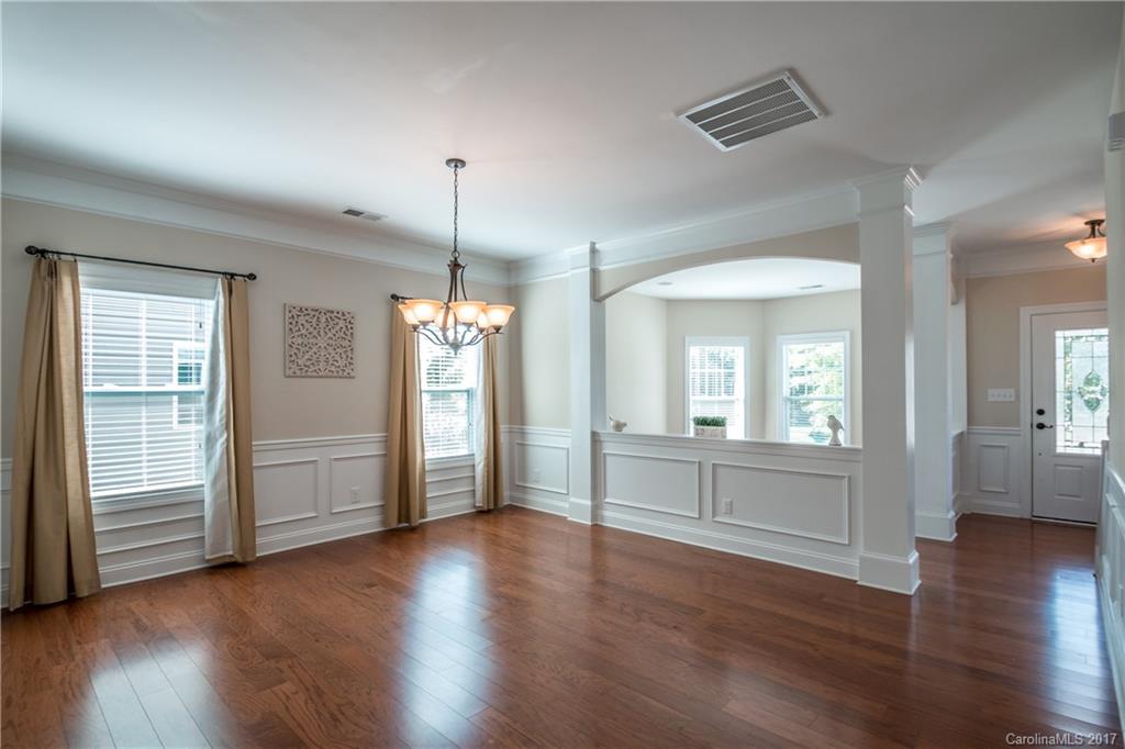 1108 Ridgehaven Road Waxhaw, NC 28173 - Photo 3 of 24 an empty room with wooden floor and windows
