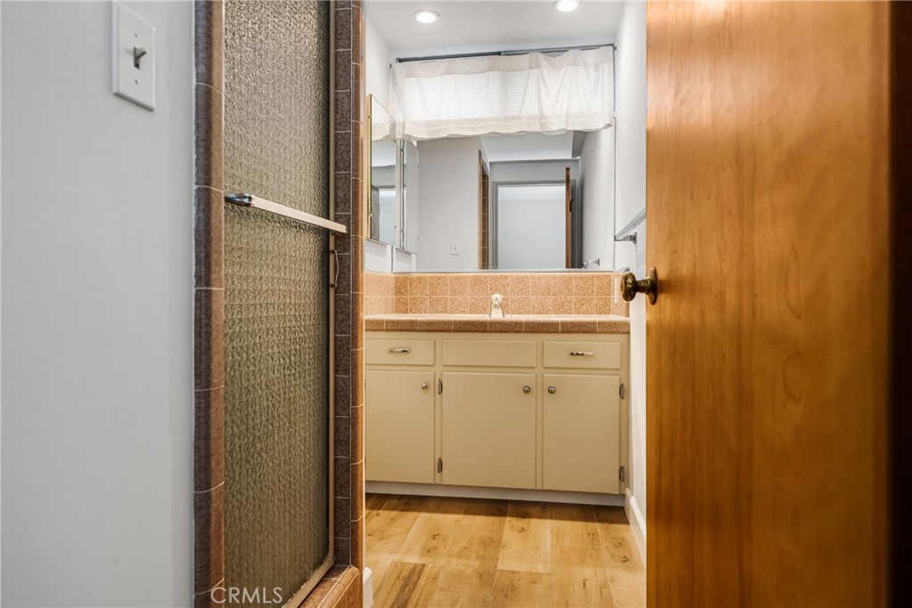 243 North Grand Street Orange, CA 92866 - Photo 20 of 25 a bathroom with a granite countertop sink and a mirror
