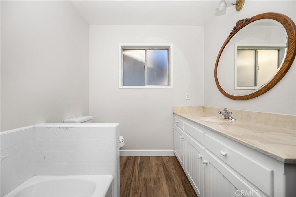 243 North Grand Street Orange, CA 92866 - Photo 25 of 25 a bathroom with a sink and a mirror