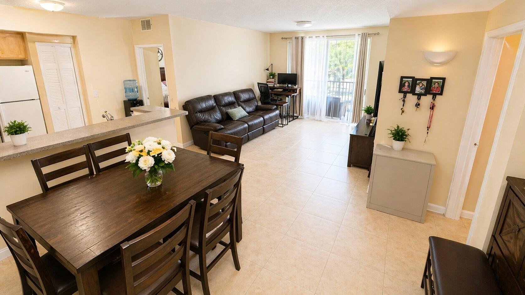 7980 North Nob Hill Road, Unit 205 Tamarac, FL 33321 - Photo 13 of 23 Open-Dining-and-Living-Room-with-Section