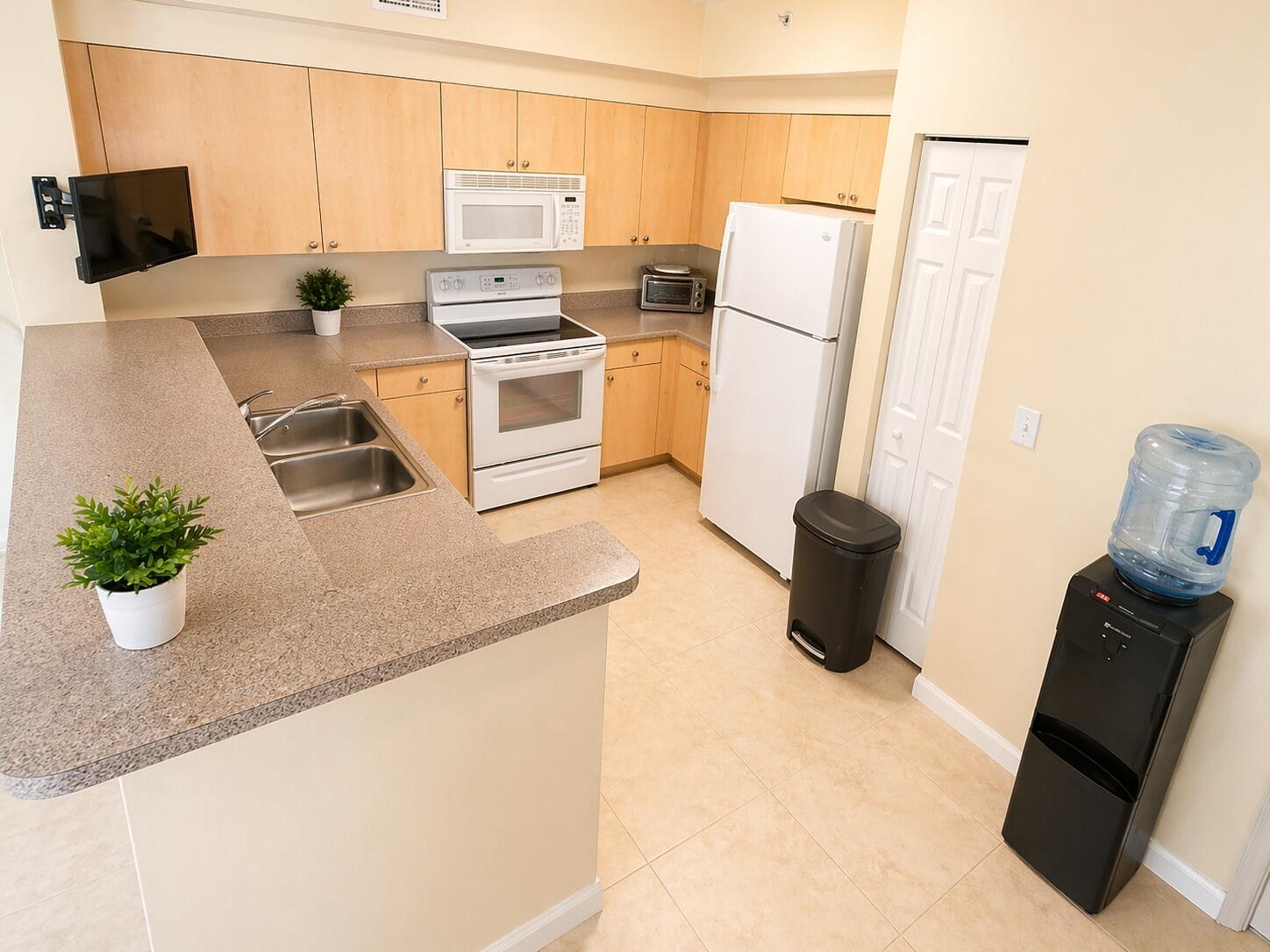 7980 North Nob Hill Road, Unit 205 Tamarac, FL 33321 - Photo 16 of 23 Kitchen-with-Water-Dispenser