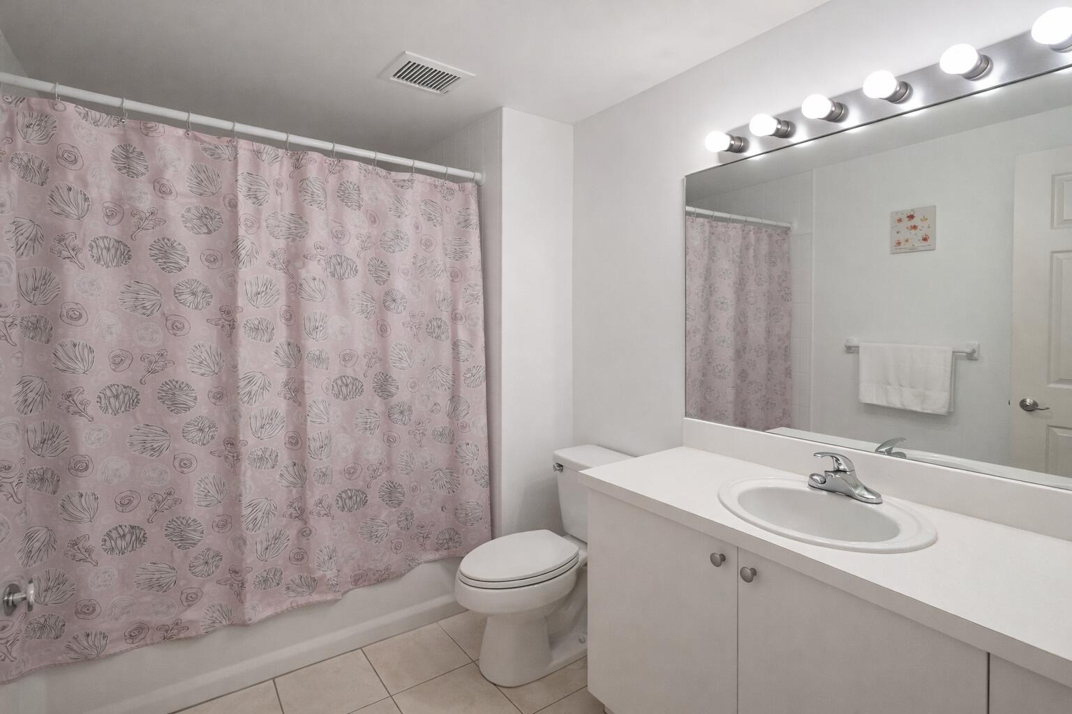 7980 North Nob Hill Road, Unit 205 Tamarac, FL 33321 - Photo 19 of 23 Modern bathroom with pink accents