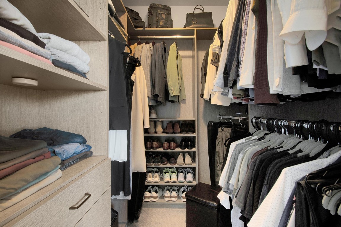 1905 Alegria Road, Unit B Austin, TX 78757 - Photo 16 of 25 Custom Primary Closet – Thoughtfully renovated with built-in storage, shelving, and hanging space to keep everything organized.