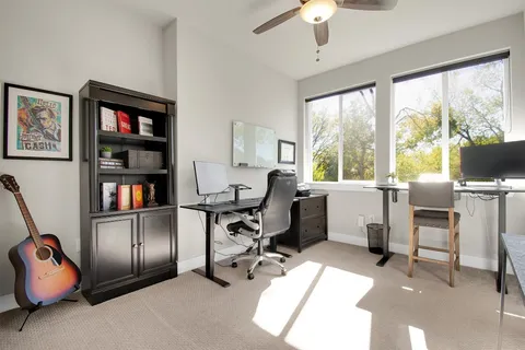 a bathroom with a double vanity sink toilet and shower