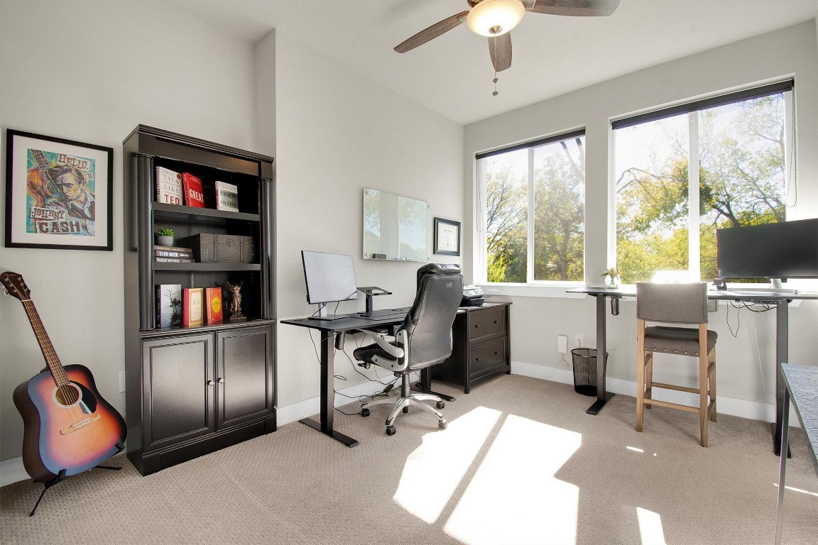 1905 Alegria Road, Unit B Austin, TX 78757 - Photo 17 of 25 Flexible Second Bedroom or Office – Bright and spacious with large windows and tree-lined views, perfect for a guest room, home office, or creative workspace.