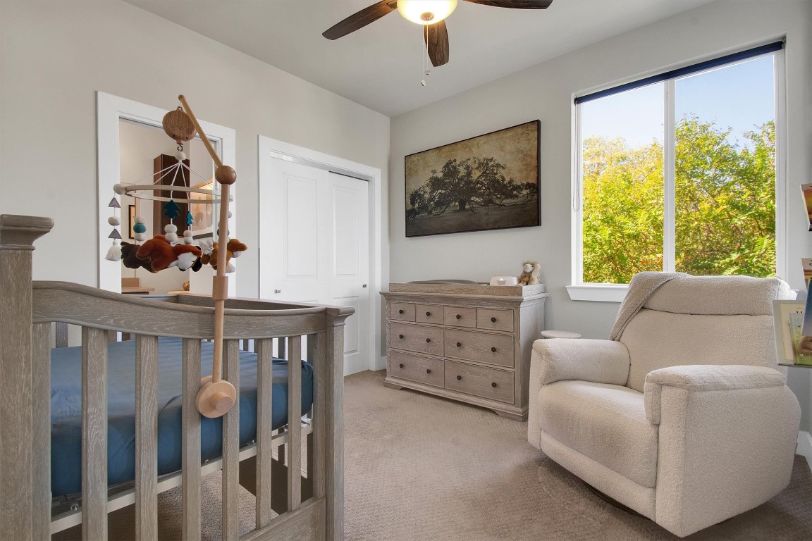 1905 Alegria Road, Unit B Austin, TX 78757 - Photo 19 of 25 Versatile Third Bedroom or Office – Peaceful and light-filled with soft carpet and modern finishes, ideal for use as a nursery, home office, or relaxing guest space.