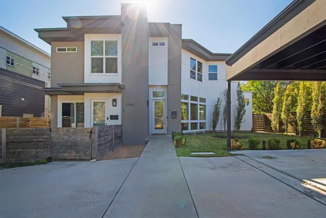 a view of a patio with couches table and chairs and potted plants
